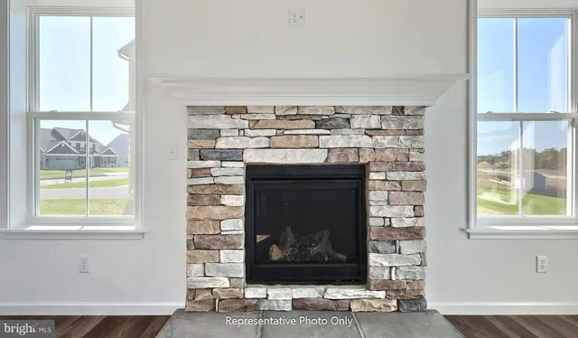 a fireplace with a window in front of it