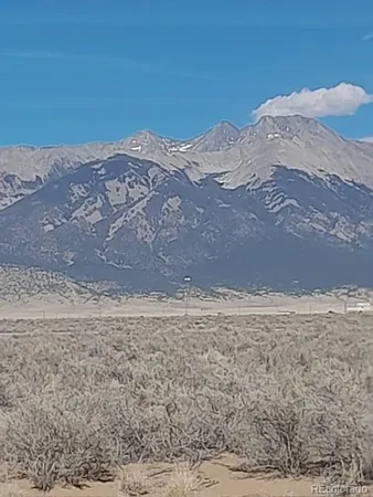a view of a mountain view with mountains in the background