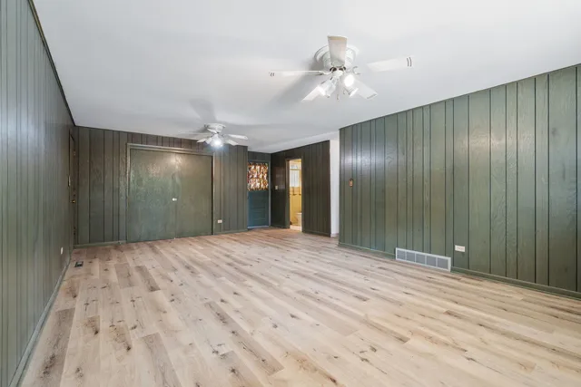 a view of an empty room with a bathroom
