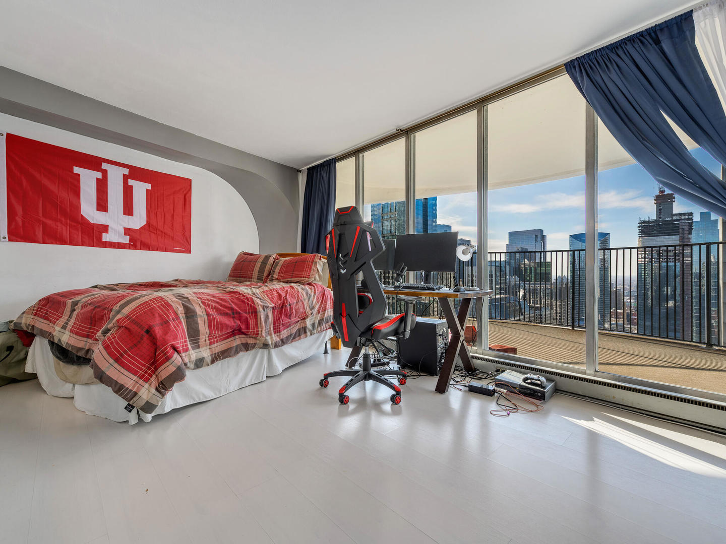 300 North State Street, Unit 4802 Chicago, IL 60654 - Photo 2 of 15 a bedroom with a bed and large window