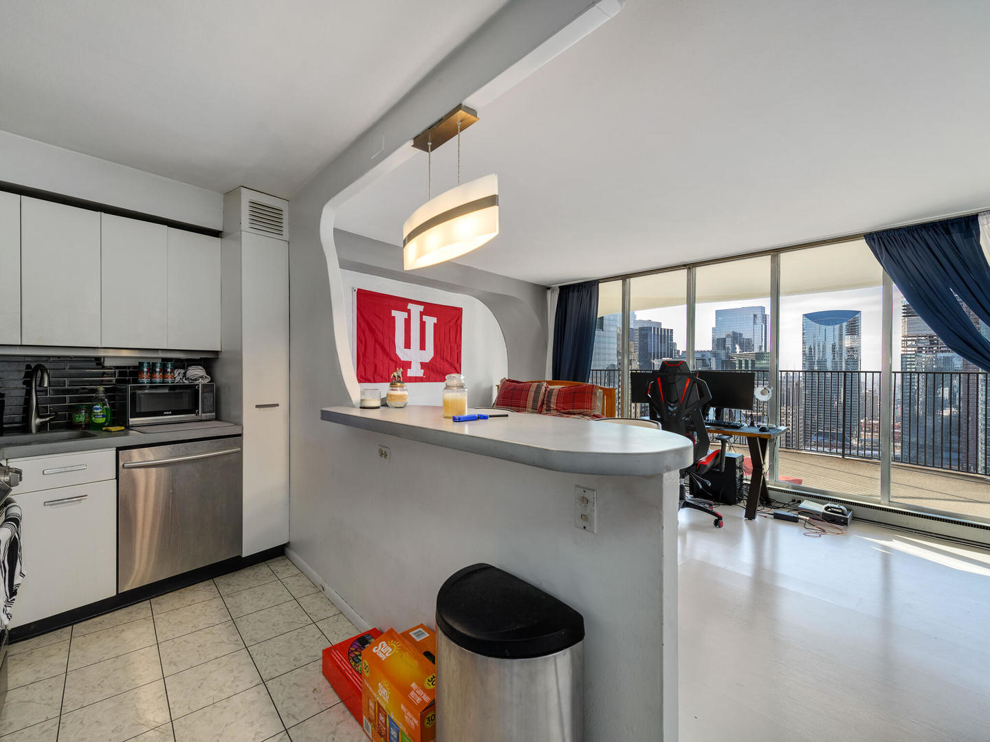 300 North State Street, Unit 4802 Chicago, IL 60654 - Photo 3 of 15 a kitchen with stainless steel appliances granite countertop a sink and a stove