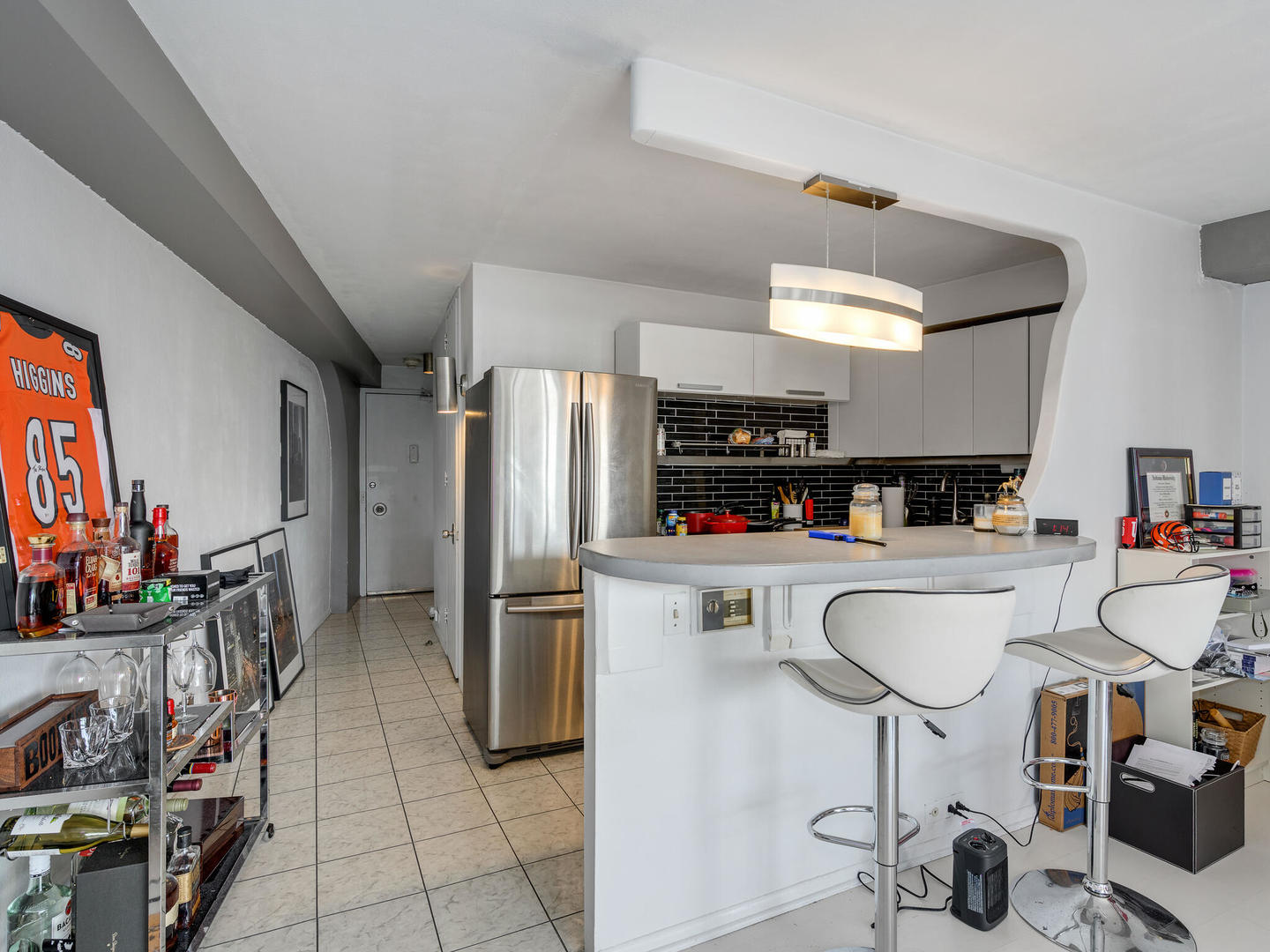 300 North State Street, Unit 4802 Chicago, IL 60654 - Photo 7 of 15 a kitchen with stainless steel appliances a refrigerator and a sink