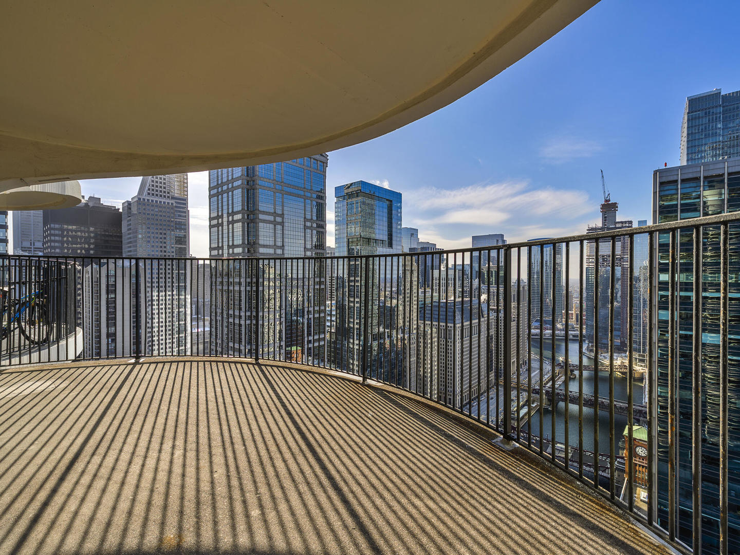 300 North State Street, Unit 4802 Chicago, IL 60654 - Photo 9 of 15 a balcony with wooden floor
