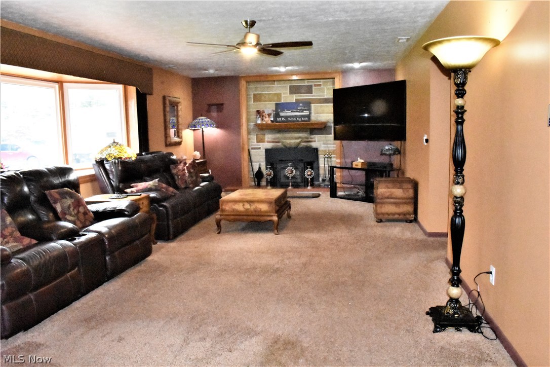 4033 Laurel Road Brunswick, OH 44212 - Photo 2 of 34 Huge 28 foot Living Room with 9 foot picture window and efficient wood burning stove.