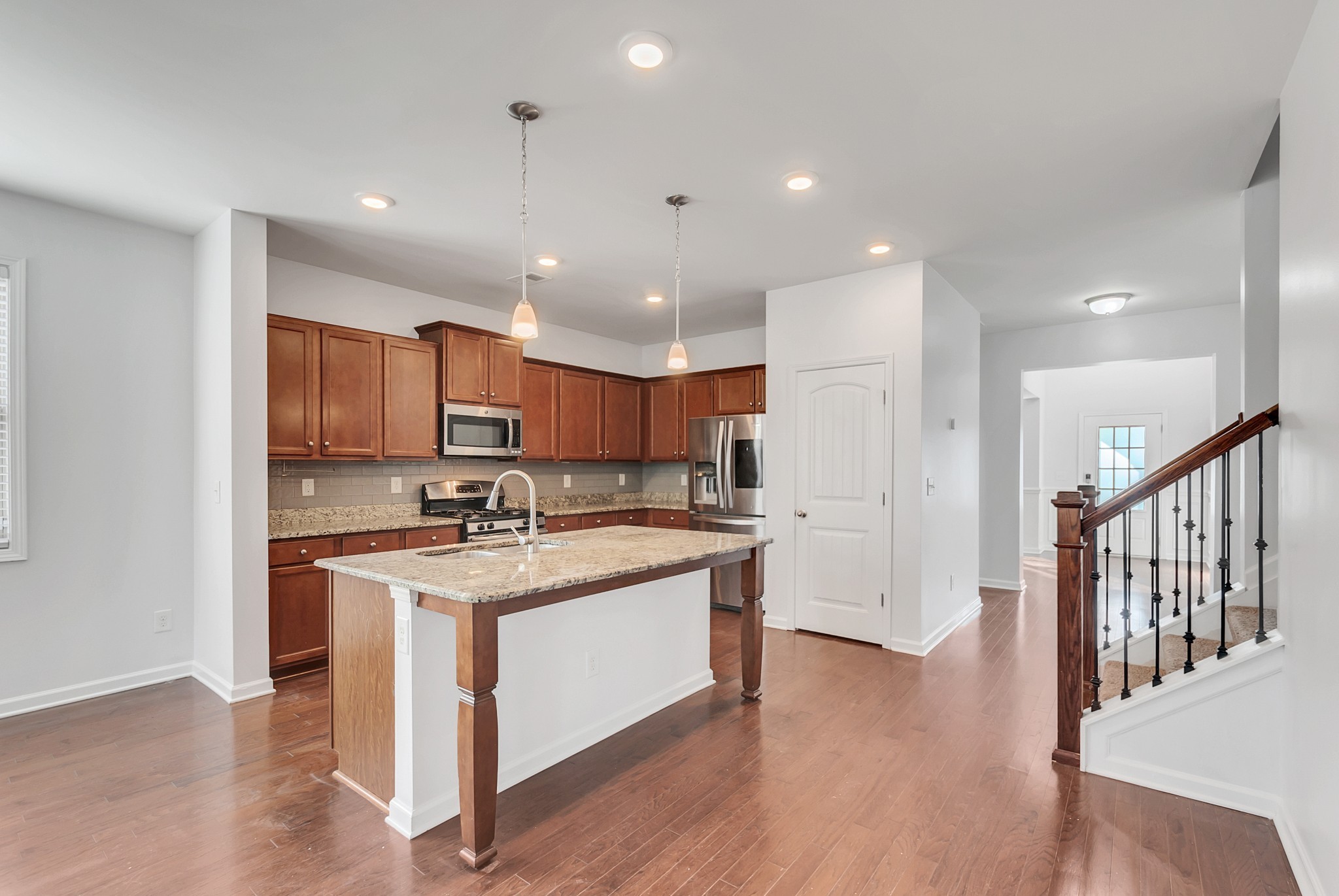 3005 Alan Drive Spring Hill, TN 37174 - Photo 13 of 41 a kitchen with stainless steel appliances granite countertop a stove and a refrigerator