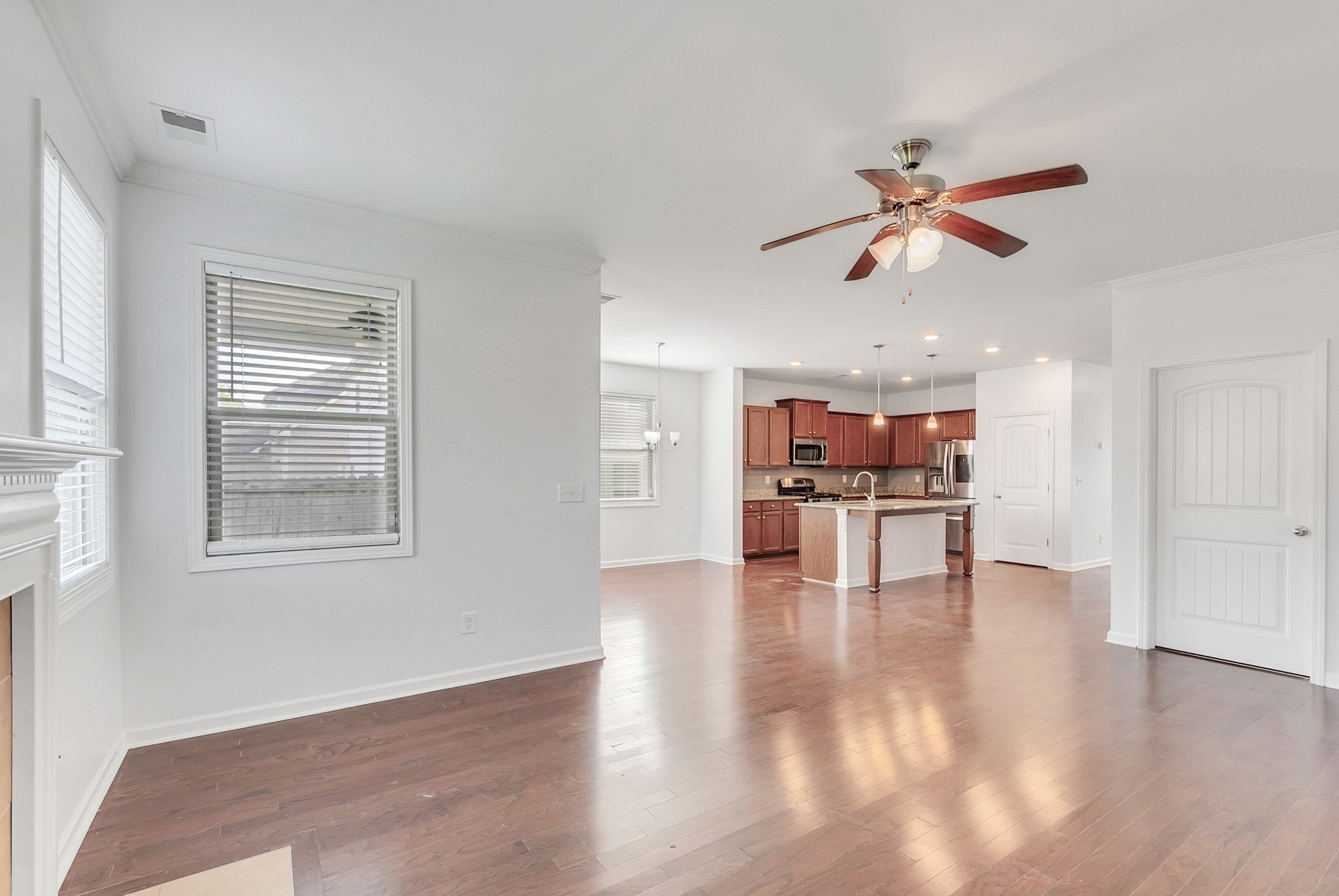 3005 Alan Drive Spring Hill, TN 37174 - Photo 19 of 41 a view of an empty room with a window and wooden floor