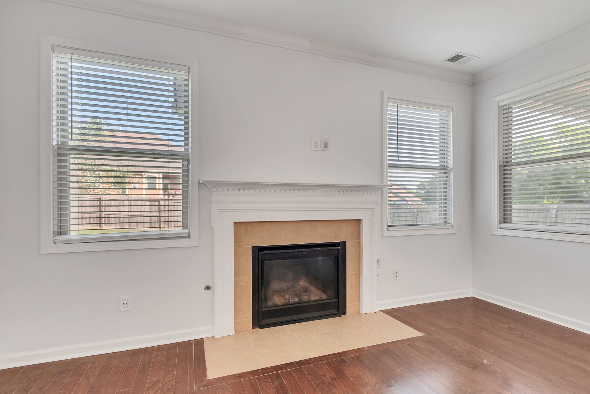 3005 Alan Drive Spring Hill, TN 37174 - Photo 20 of 41 a living room with a fireplace and wooden floor