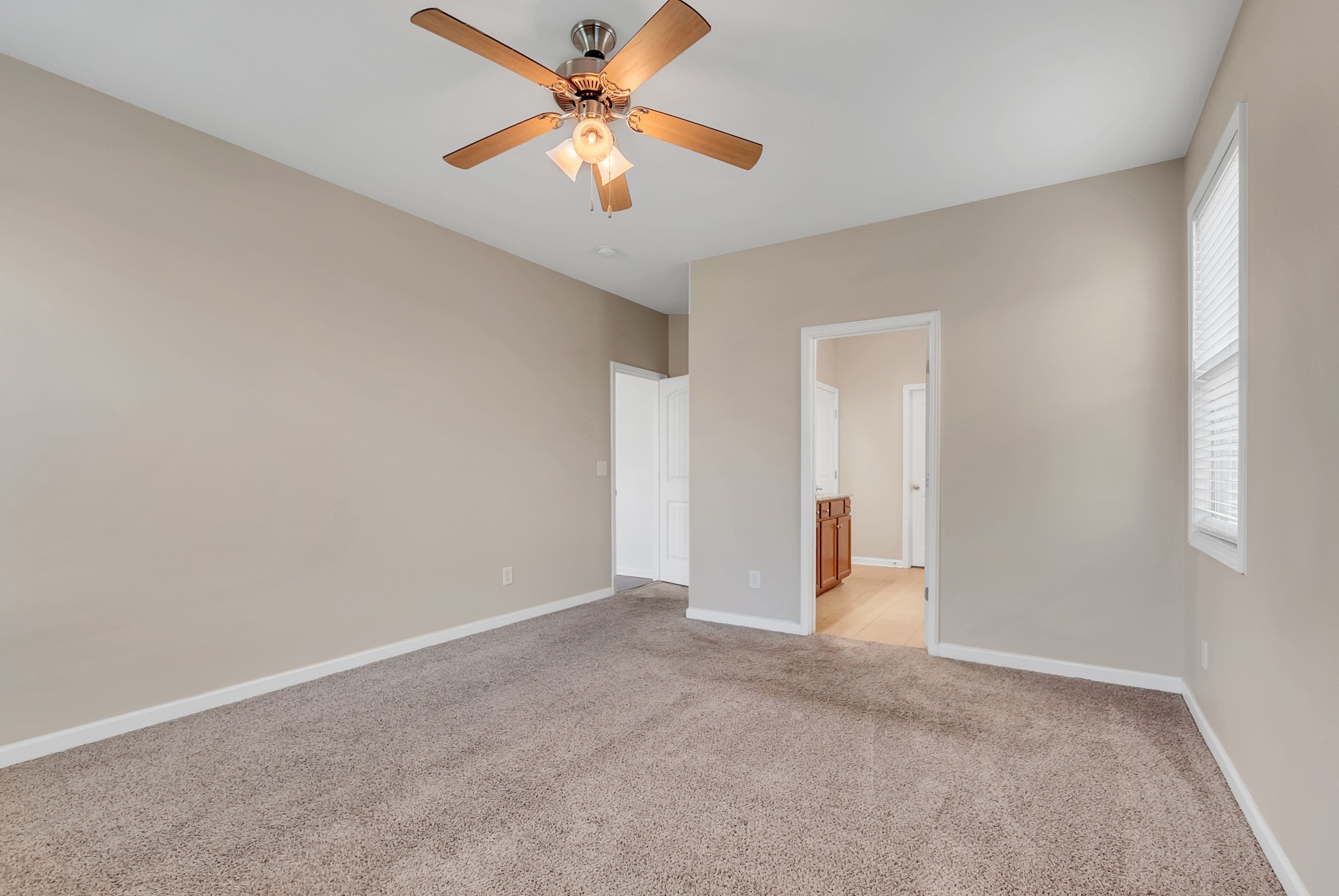 3005 Alan Drive Spring Hill, TN 37174 - Photo 22 of 41 an empty room with closet and a ceiling fan