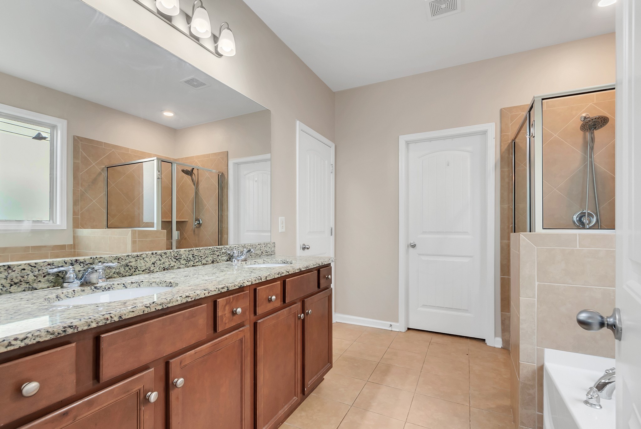 3005 Alan Drive Spring Hill, TN 37174 - Photo 23 of 41 a bathroom with a granite countertop sink and a mirror