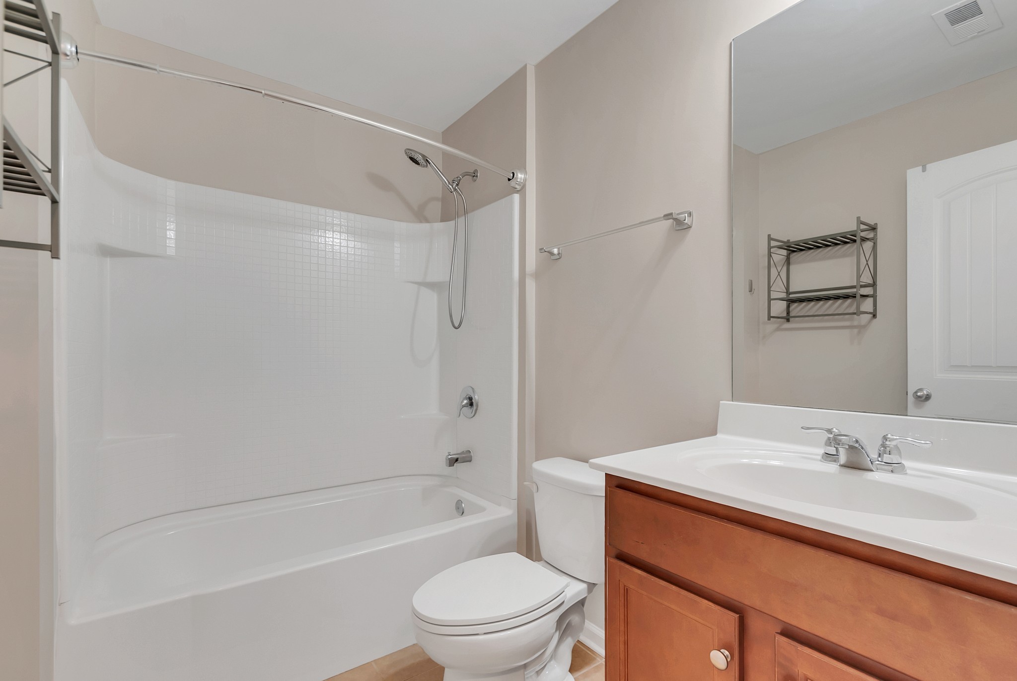 3005 Alan Drive Spring Hill, TN 37174 - Photo 28 of 41 a bathroom with a granite countertop sink a toilet and shower