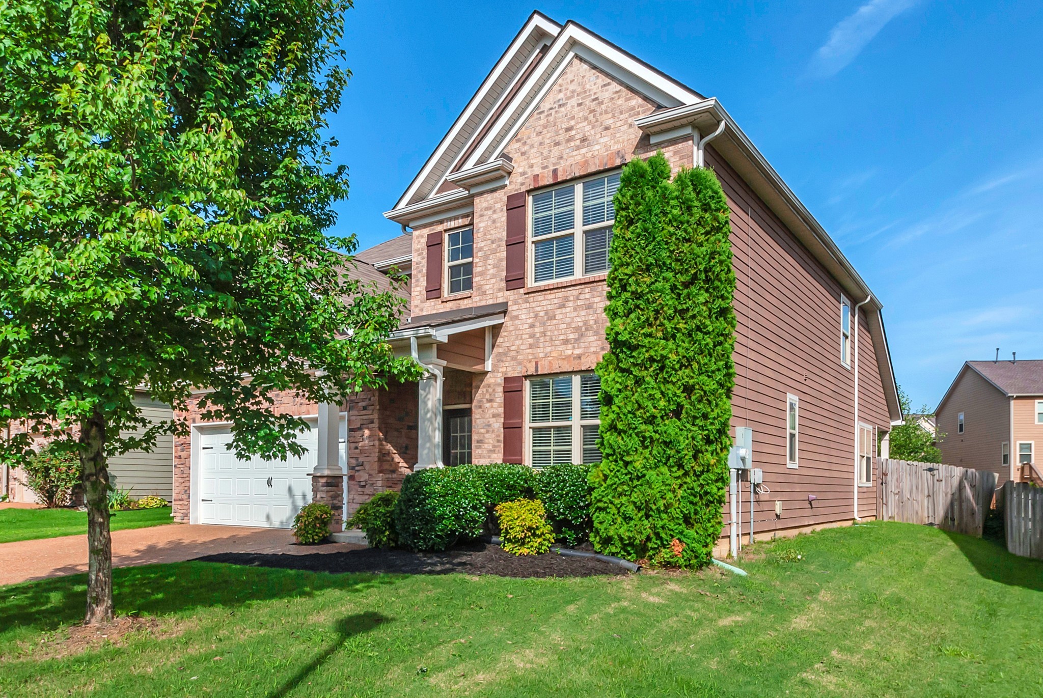 3005 Alan Drive Spring Hill, TN 37174 - Photo 4 of 41 a front view of a house with a yard and trees