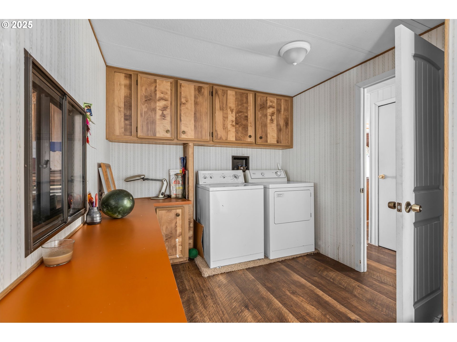 5969 Southwest Sundance Lane Culver, OR 97734 - Photo 11 of 23 a view of a kitchen with a sink and dishwasher with wooden floor