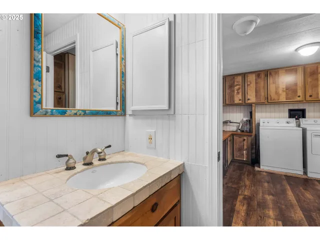 a kitchen with a sink cabinets and appliances