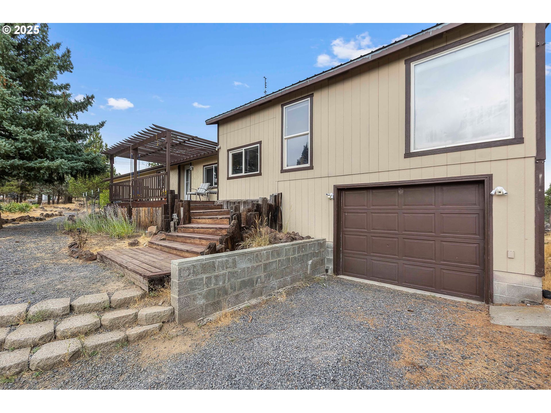5969 Southwest Sundance Lane Culver, OR 97734 - Photo 19 of 23 a view of a house with a patio