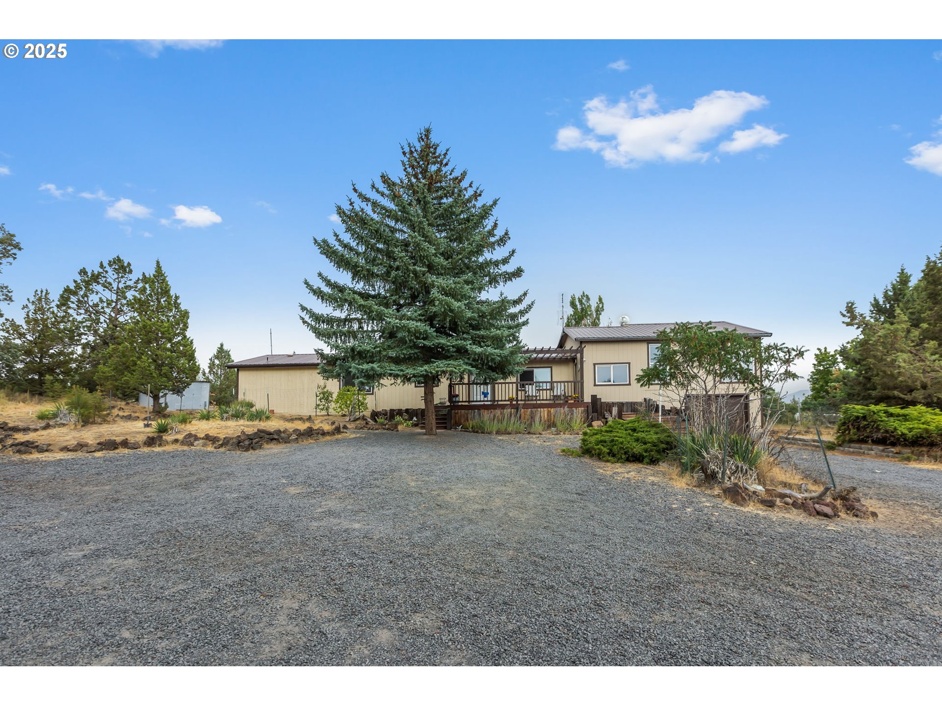 5969 Southwest Sundance Lane Culver, OR 97734 - Photo 2 of 23 a view of a house with a backyard