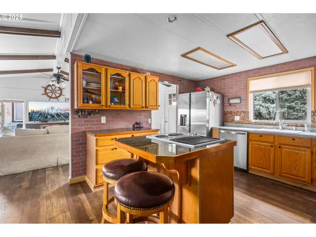 a kitchen with a sink and wooden cabinets