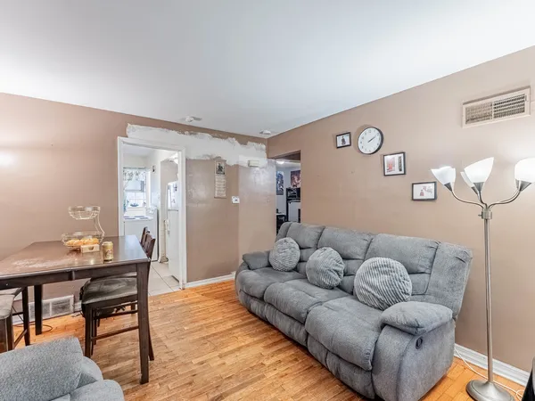 a living room with furniture and a table