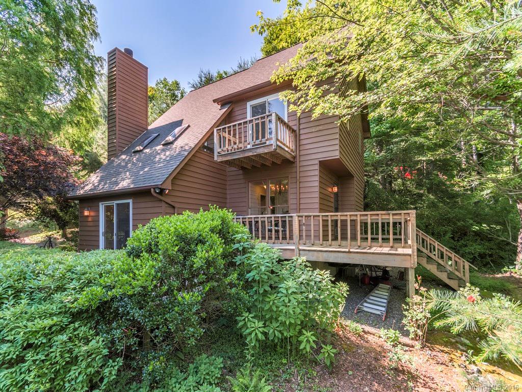 322 Old Country Road Waynesville, NC 28786 - Photo 1 of 12 a view of house with deck and trees