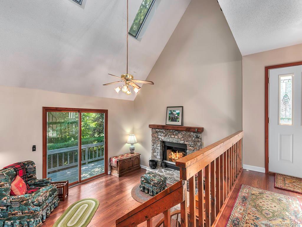 322 Old Country Road Waynesville, NC 28786 - Photo 3 of 12 a living room with furniture and a fireplace