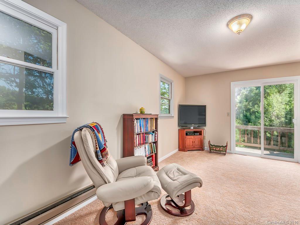 322 Old Country Road Waynesville, NC 28786 - Photo 7 of 12 a living room with furniture and a flat screen tv