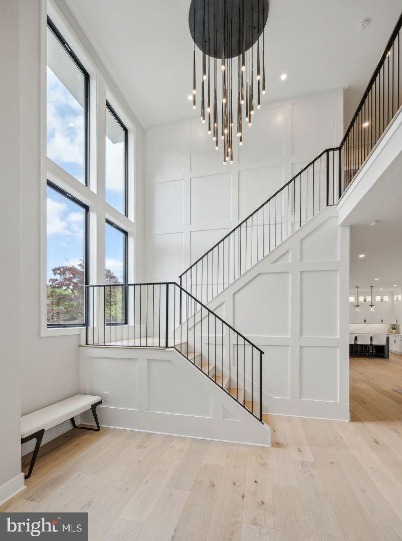 761 Mt Moro Road Villanova, PA 19085 - Photo 11 of 92 a view of staircase with a floor to ceiling window and a chandelier