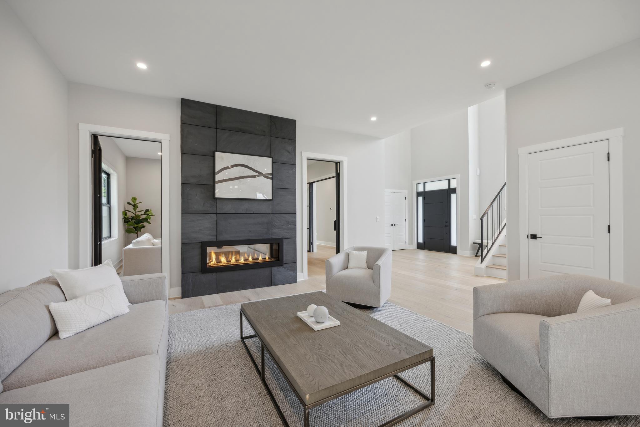 761 Mt Moro Road Villanova, PA 19085 - Photo 13 of 92 a living room with furniture and a fireplace