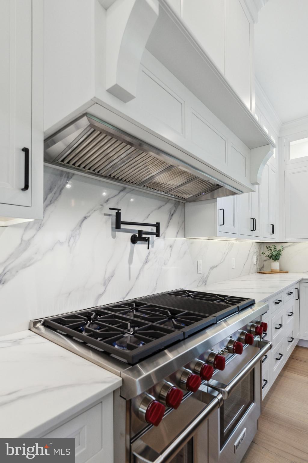 761 Mt Moro Road Villanova, PA 19085 - Photo 23 of 92 a stove sitting inside of a kitchen with white cabinets
