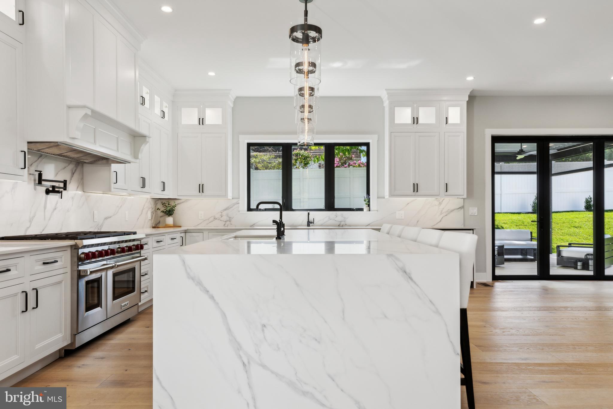 761 Mt Moro Road Villanova, PA 19085 - Photo 24 of 92 a large white kitchen with a large window a sink and stainless steel appliances
