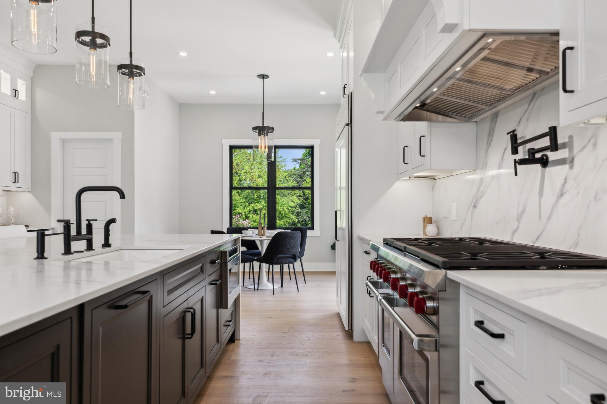 761 Mt Moro Road Villanova, PA 19085 - Photo 25 of 92 a kitchen with stainless steel appliances granite countertop a stove a sink and a refrigerator