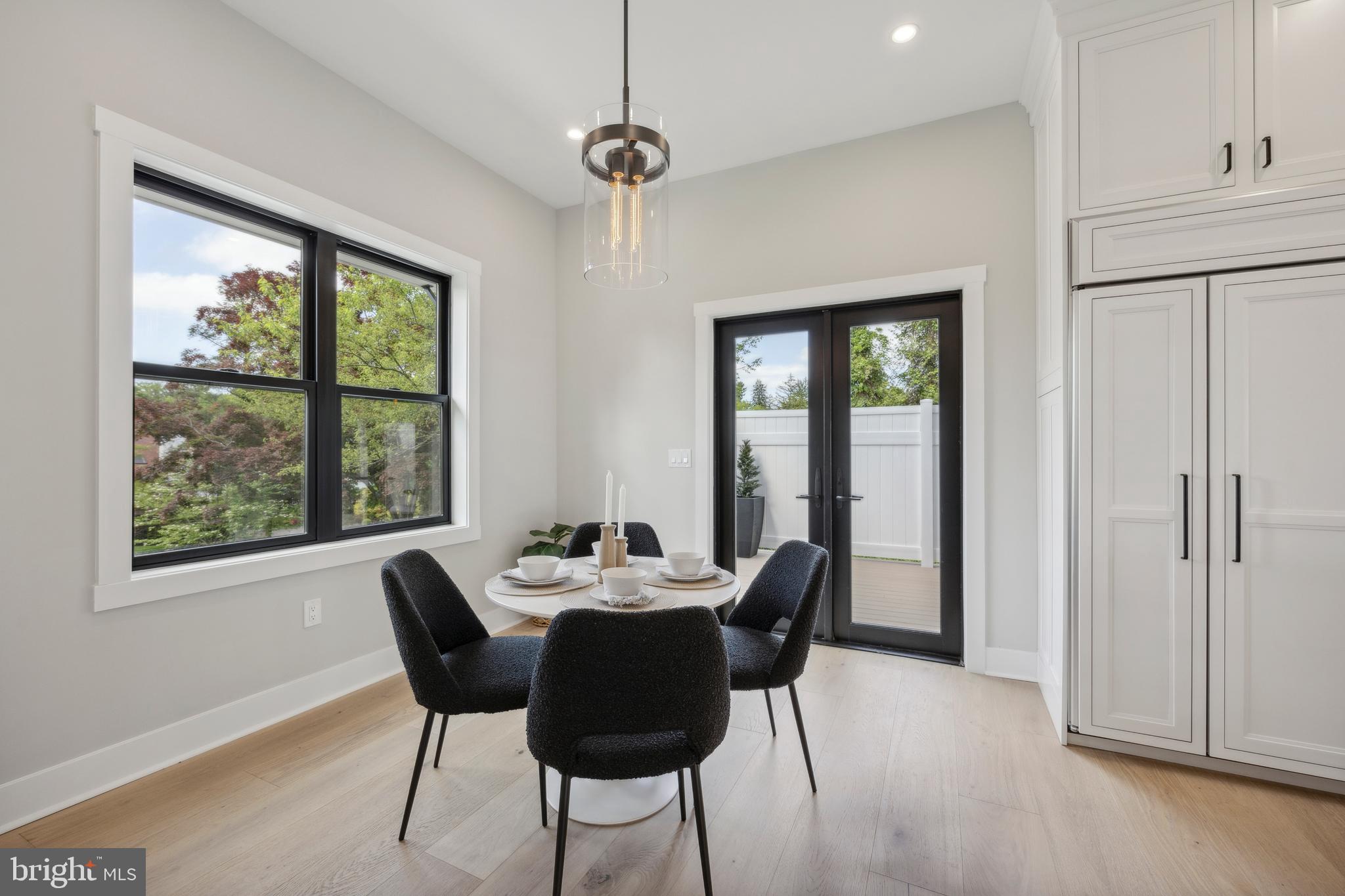 761 Mt Moro Road Villanova, PA 19085 - Photo 27 of 92 a dining room with furniture a chandelier and wooden floor