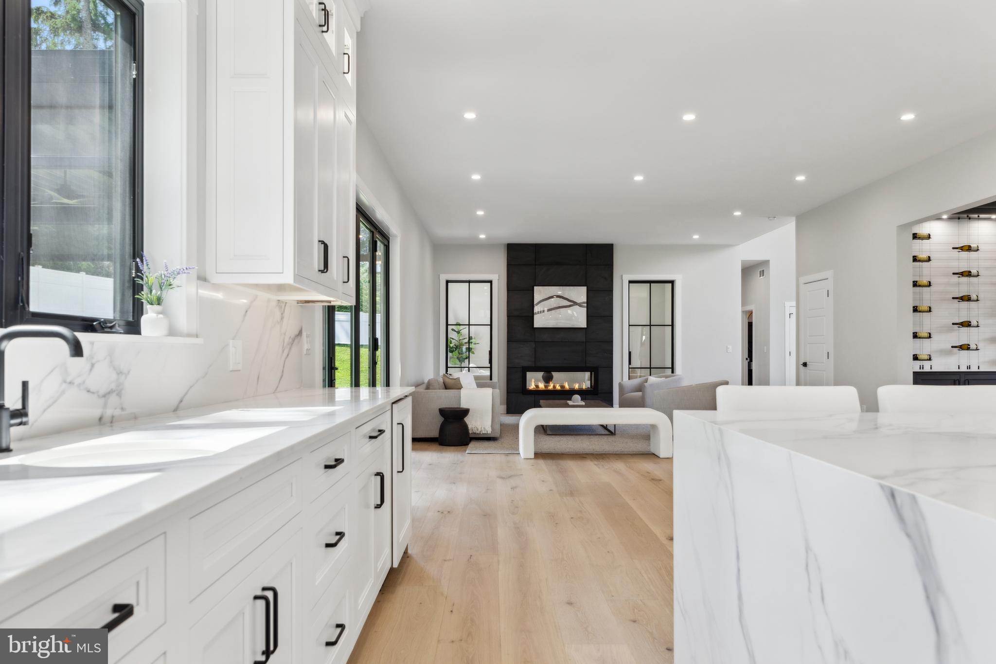 761 Mt Moro Road Villanova, PA 19085 - Photo 33 of 92 a large white kitchen with granite countertop a large window and a sink