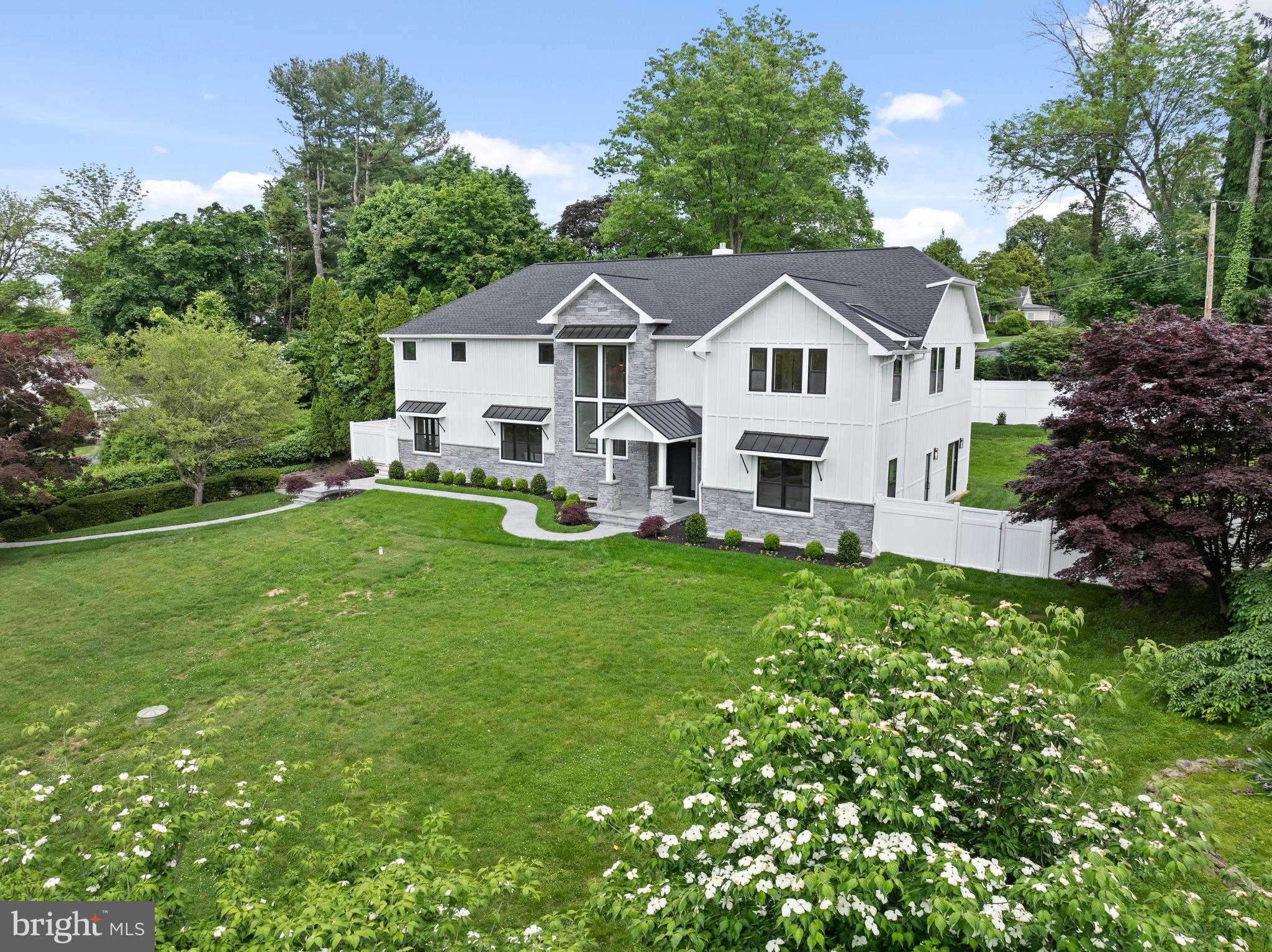 761 Mt Moro Road Villanova, PA 19085 - Photo 4 of 92 a front view of a house with a yard porch and green space