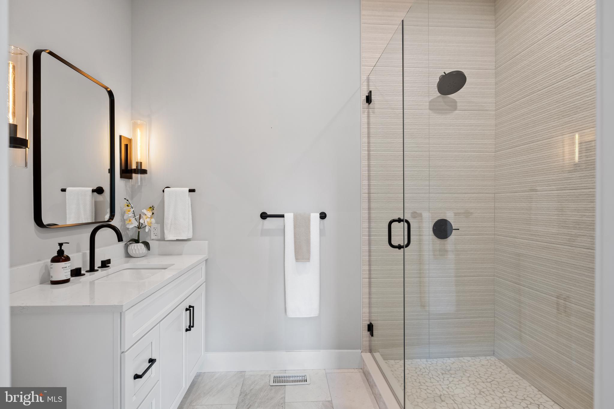 761 Mt Moro Road Villanova, PA 19085 - Photo 51 of 92 a bathroom with a double vanity sink mirror and shower