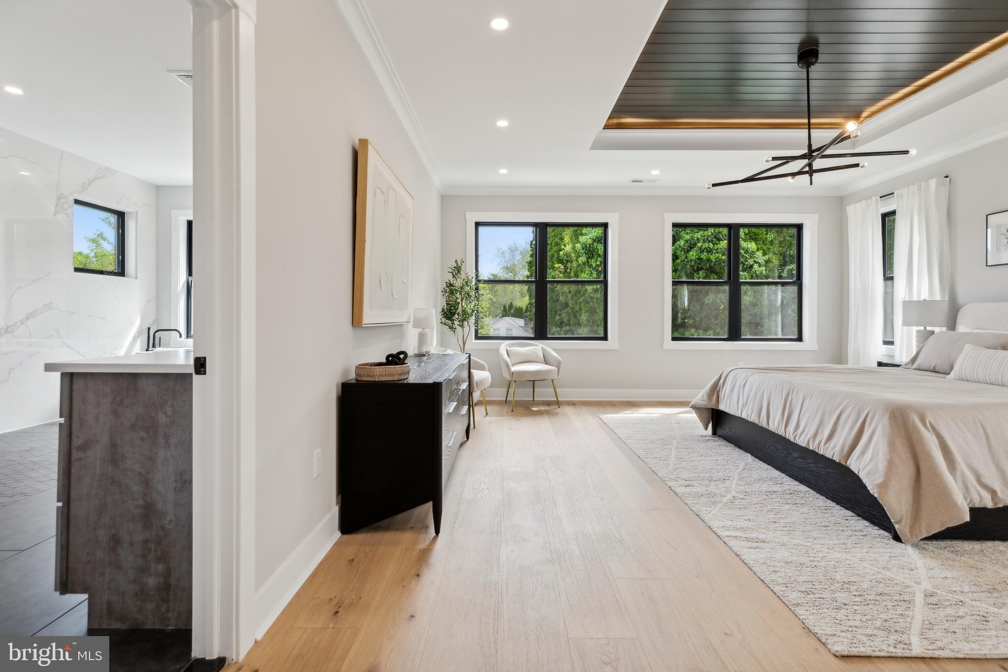 761 Mt Moro Road Villanova, PA 19085 - Photo 63 of 92 a spacious bedroom with a large bed and a large window