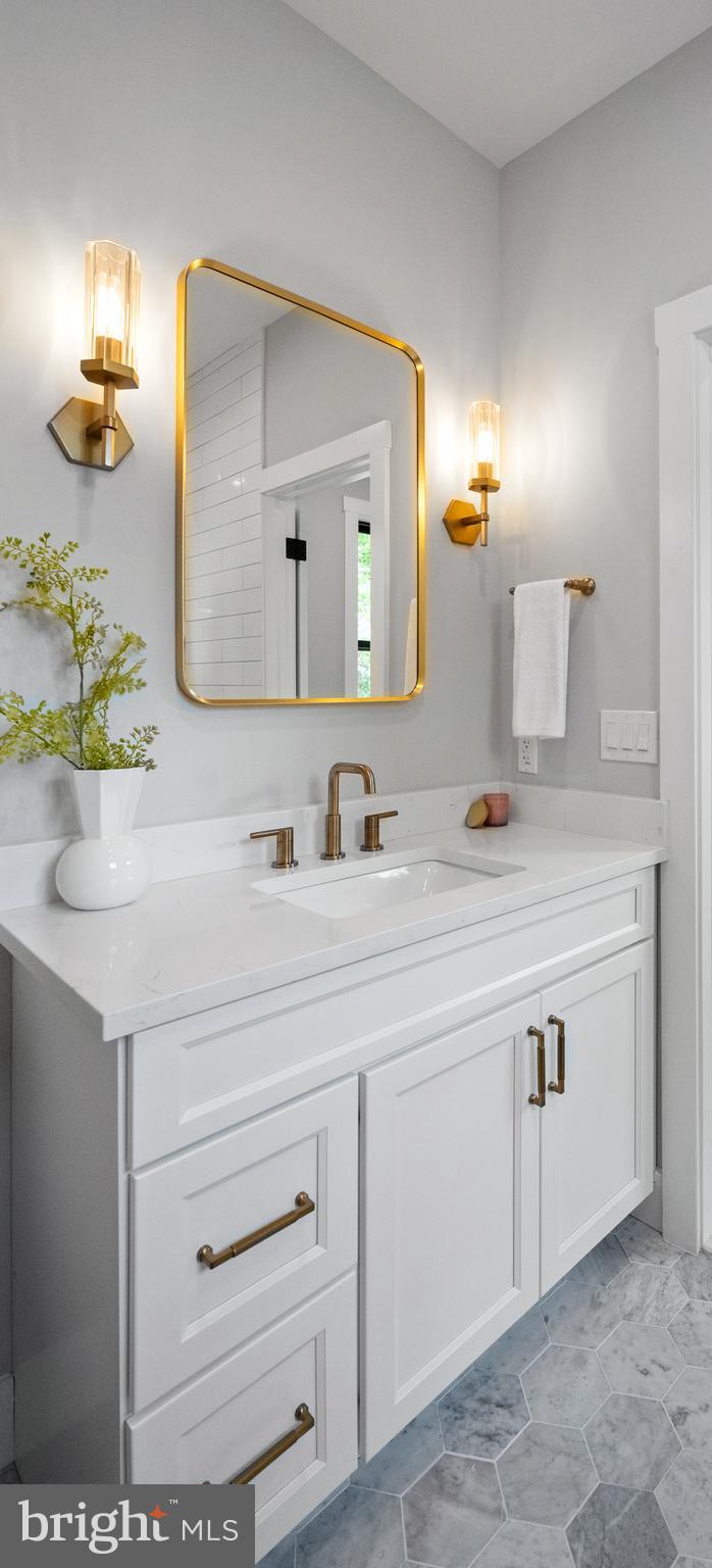 761 Mt Moro Road Villanova, PA 19085 - Photo 77 of 92 a bathroom with a sink and a mirror