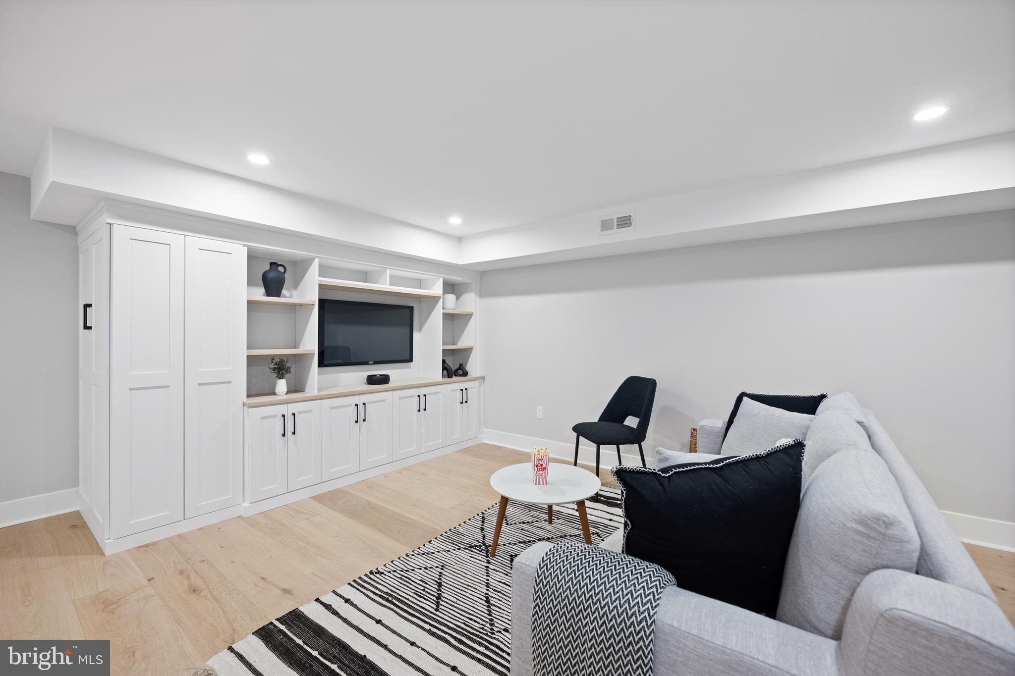761 Mt Moro Road Villanova, PA 19085 - Photo 89 of 92 a living room with furniture and a flat screen tv