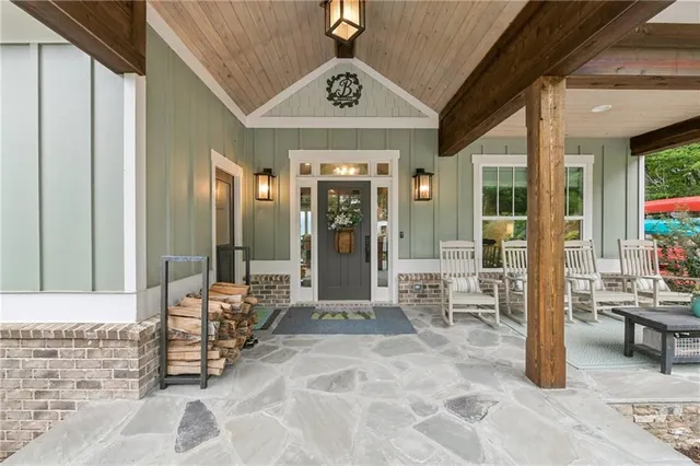 a living room with furniture fireplace and flat screen tv