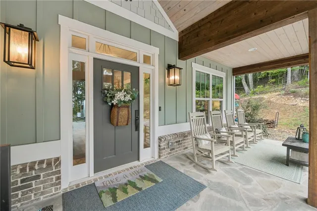 a living room with furniture potted plant and a window