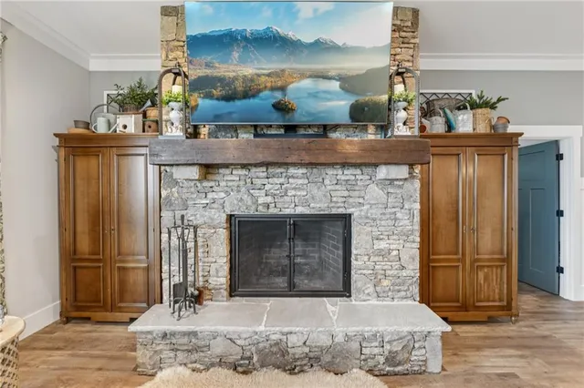 a kitchen with stainless steel appliances kitchen island granite countertop a sink stove and refrigerator