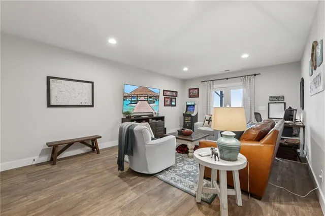 a view of a hallway with staircase and a workspace