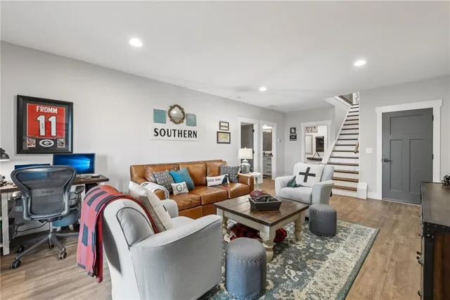 a kitchen with stainless steel appliances a stove a sink a refrigerator and a stove