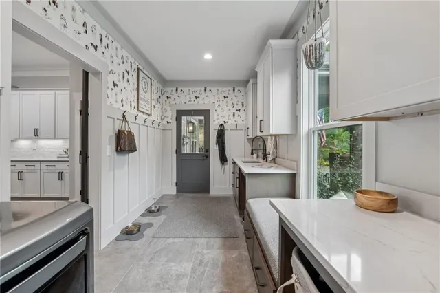 a bedroom with a bed a dresser and a book shelf