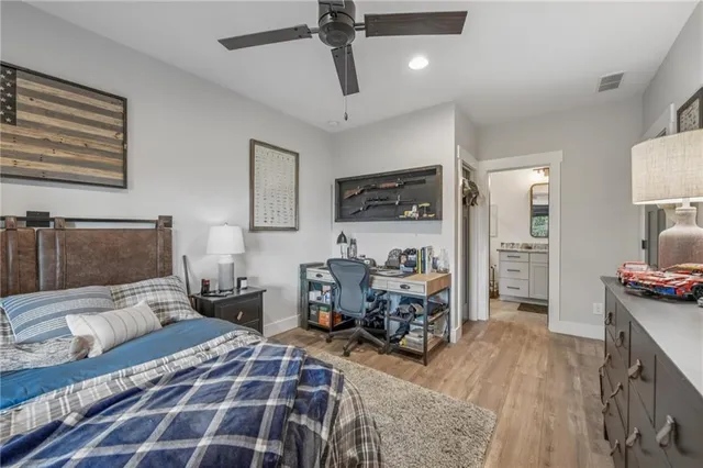 a front view of a house with yard and green space