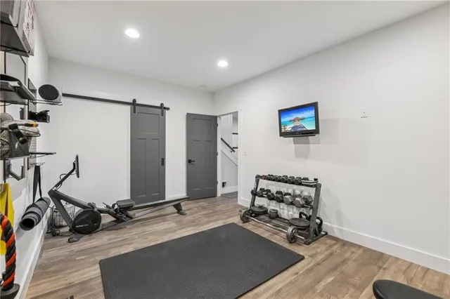 an aerial view of a house with a yard and trees