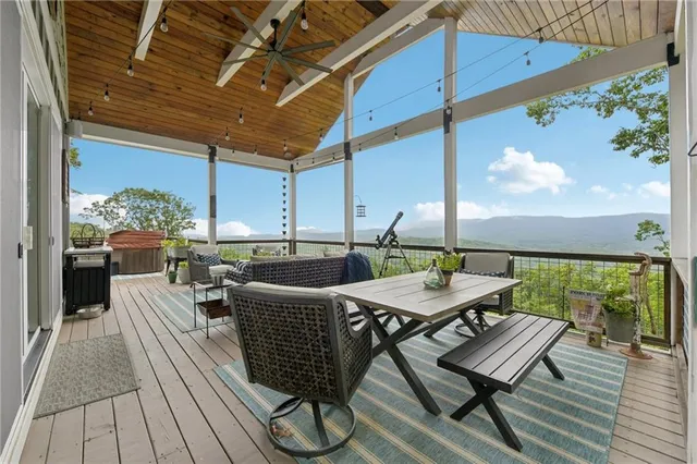 a lobby with furniture and floor to ceiling window