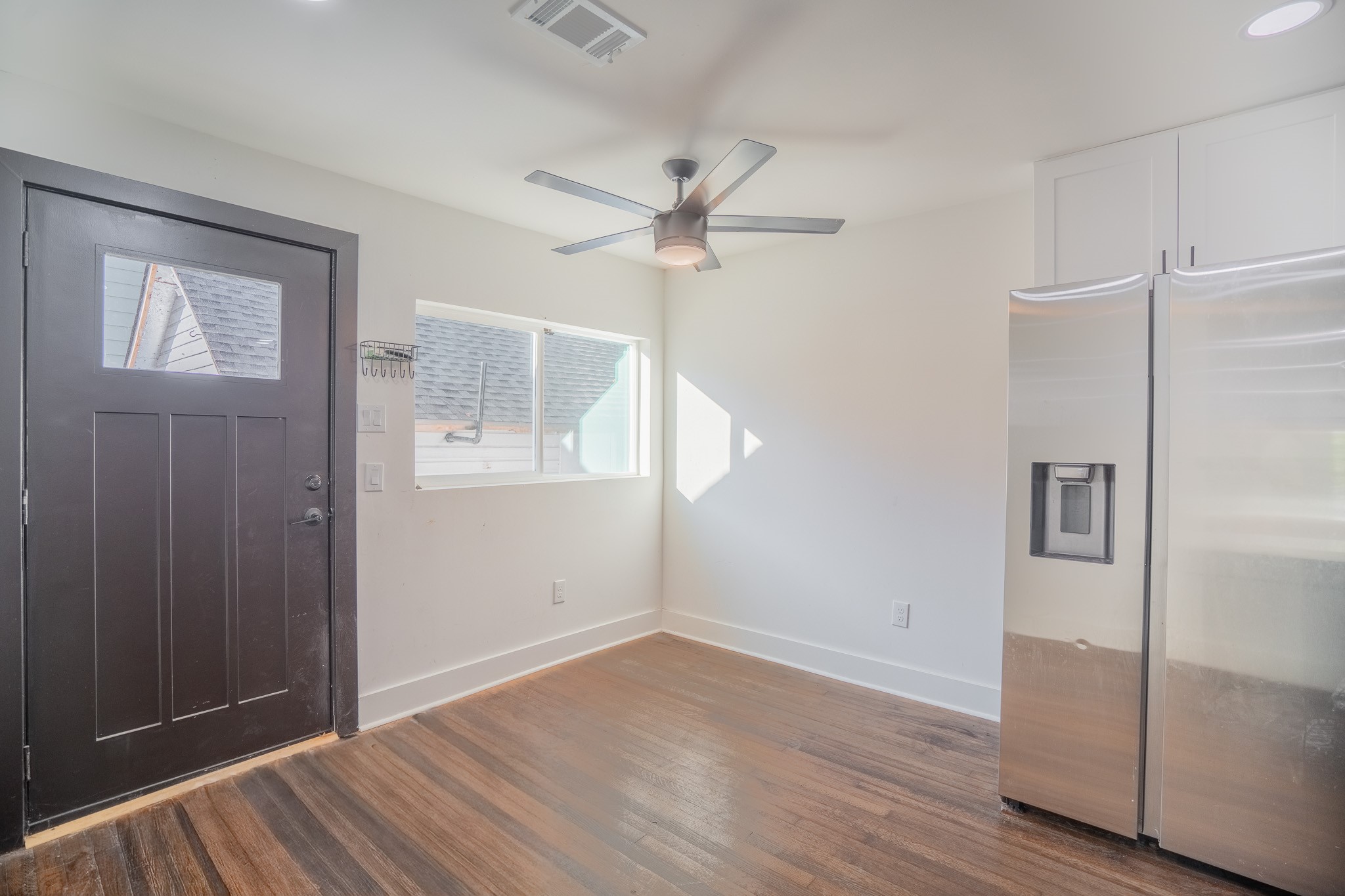 7305 Capitol Street Houston, TX 77011 - Photo 8 of 16 wooden floor in an empty room with a window