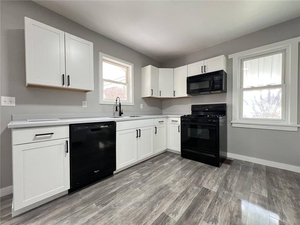 37 Lebanon Avenue Uniontown, PA 15401 - Photo 5 of 15 a kitchen with a white stove top oven and sink