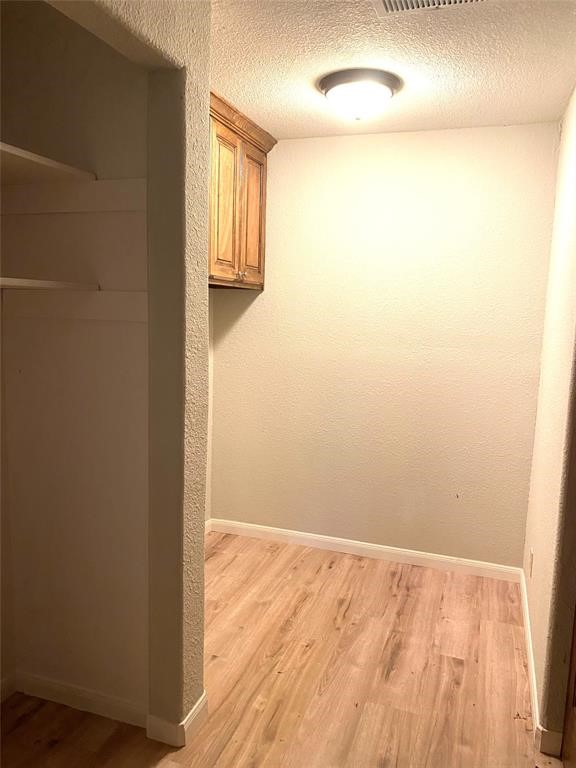 137 Road Runner Lane Bastrop, TX 78602 - Photo 12 of 18 a view of empty room with wooden floor