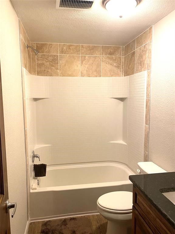 137 Road Runner Lane Bastrop, TX 78602 - Photo 15 of 20 a bathroom with a toilet a sink and a shower