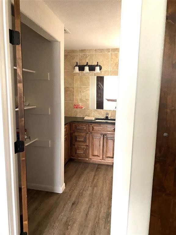 137 Road Runner Lane Bastrop, TX 78602 - Photo 16 of 18 a view of a kitchen from the hallway